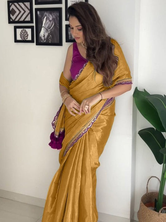 Exquisite Mustard Tissue Silk Saree With Dulcet Blouse Piece